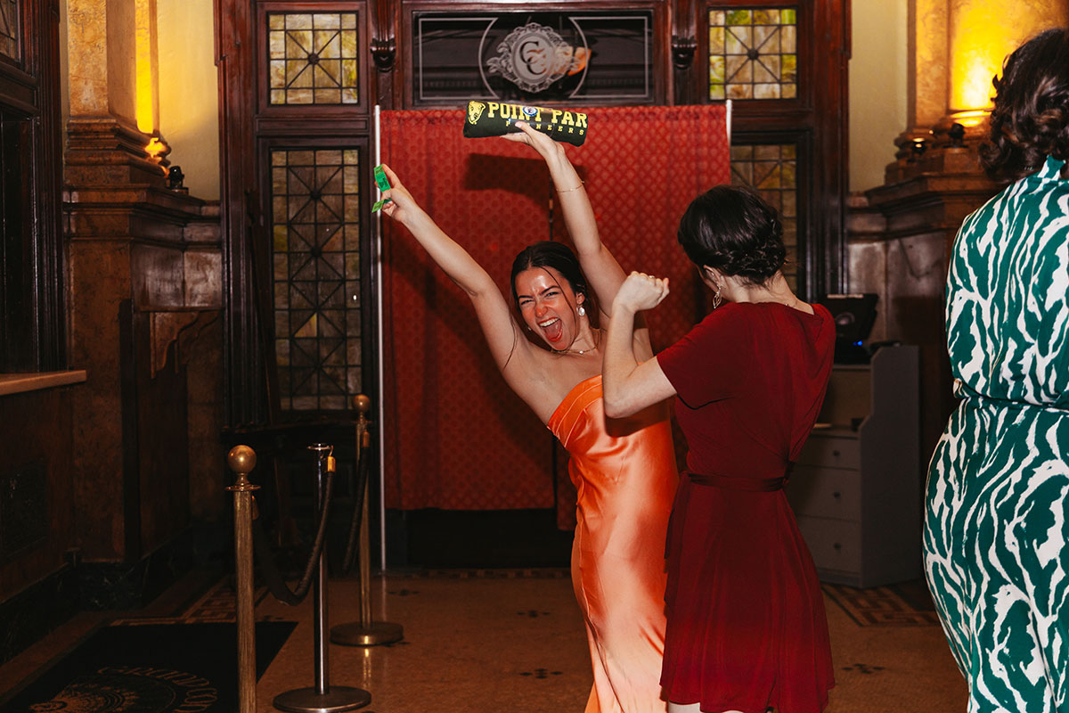 A female student cheers at Grand Concourse
